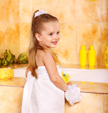 Little girl washing in bubble bath .の写真素材