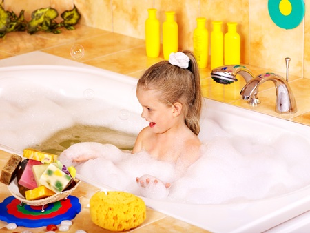 Child washing in bubble bath .の写真素材