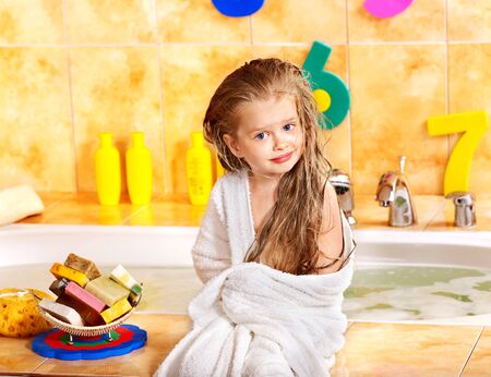 Child washing in bubble bath .の写真素材
