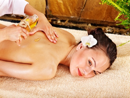 Beautiful young woman getting massage in spa.の写真素材