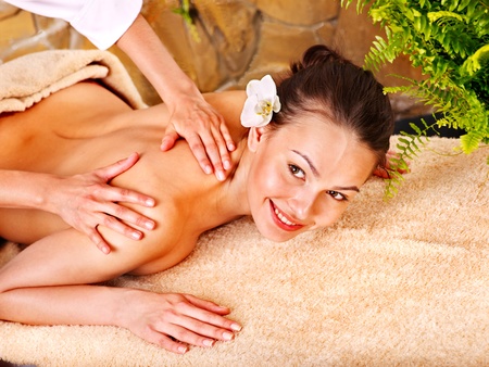 Beautiful young woman getting massage in spa.の写真素材