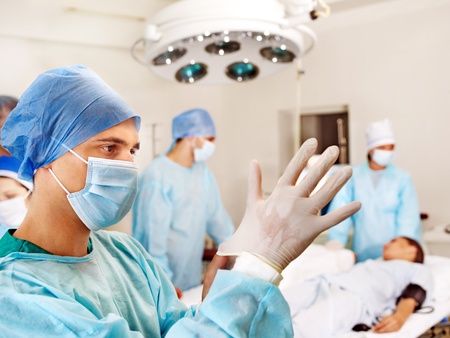 Sick patient on gurney in operating room.の写真素材