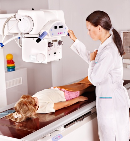 Little girl with doctor radiologist.の写真素材