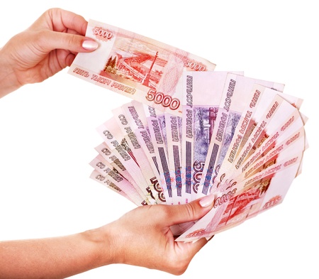Female hand with  money Russian rouble. Isolated.の写真素材