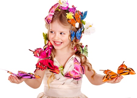 Little girl in spring hairstyle and butterfly. Isolated.の写真素材