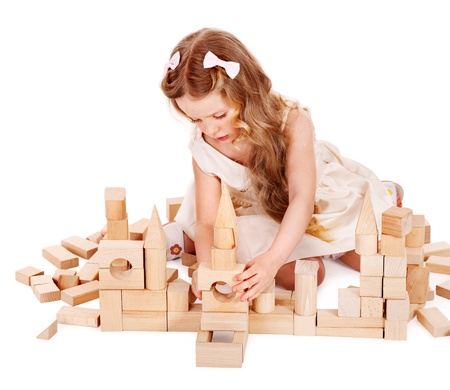 Happy child playing building blocks. Isolated.の写真素材
