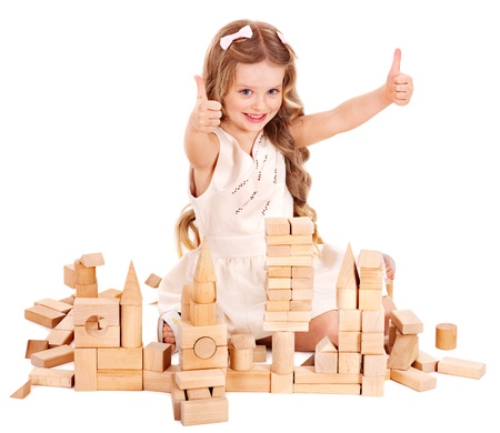 Happy child playing building blocks. Isolated.の写真素材