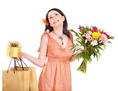 Girl with spring flower, gift box and shopping bag.  Isolated.の写真素材