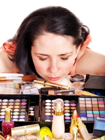 Girl applying makeup. Isolated.の写真素材
