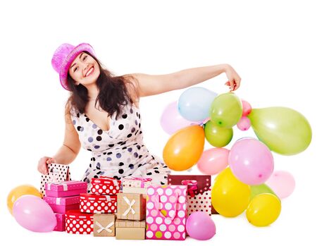 Young woman holding gift box at birthday party.の写真素材