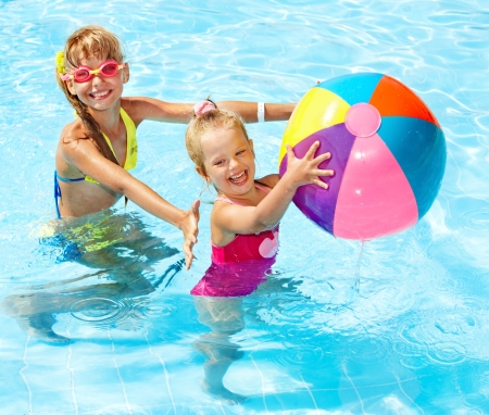 Little girl  swimming in pool.の写真素材