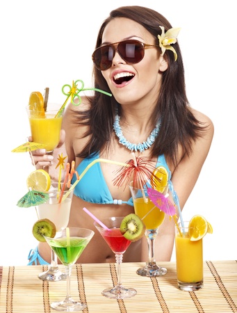Young woman in bikini on beach drinking cocktail. Isolated.の写真素材