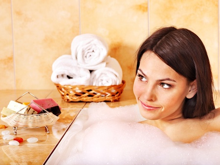 Young woman take bubble  bath.の写真素材