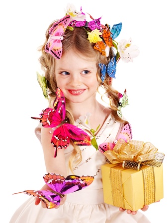 Little girl with butterfly holding gift box. Isolated.の写真素材