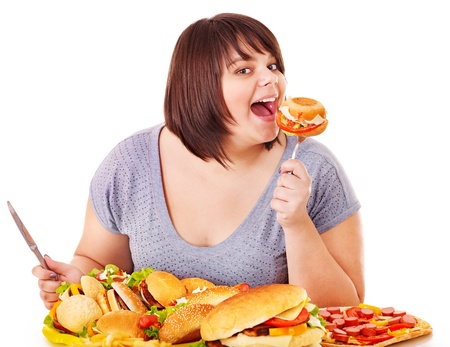 Woman eating fast food. Isolated.の写真素材
