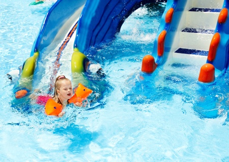 Child with armbands in swimming pool. Summer outdoor.の写真素材