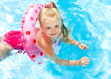 Children playing in swimming pool. Summer outdoor.の写真素材