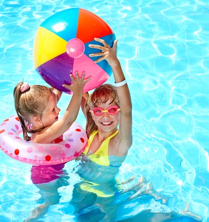 Child playing in swimming pool. Summer outdoor.の写真素材