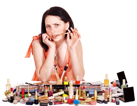 Girl applying makeup. Isolated.の写真素材