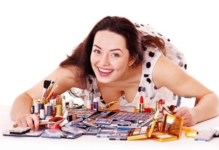 Girl applying makeup. Isolated.の写真素材