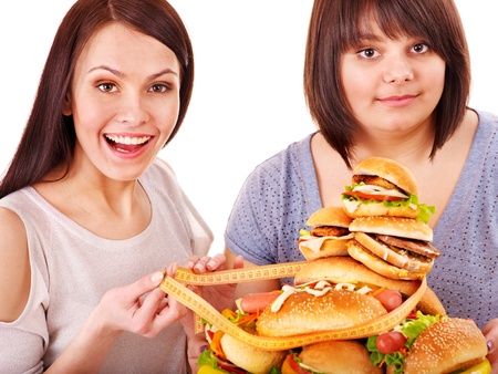 Women eating hamburger. Isolated.の写真素材