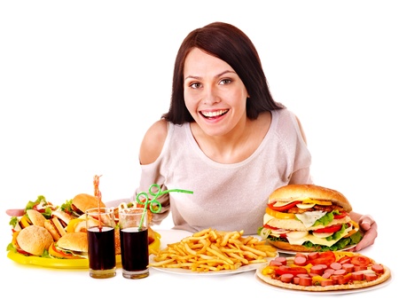 Woman eating fast food. Isolated.の写真素材