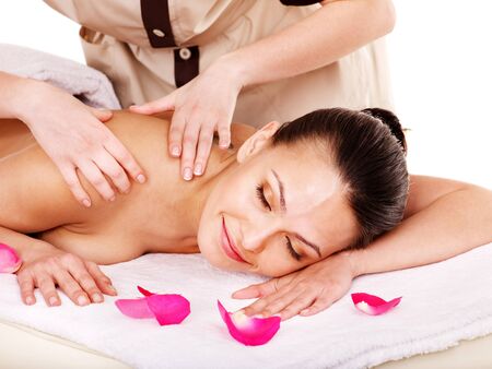 Young woman getting massage in spa . Isolated.の写真素材