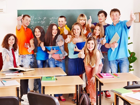 Group student near blackboard in classroom.の写真素材
