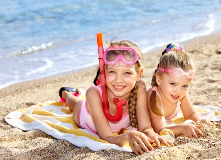 Children  playing summer outdoor on  beach.の写真素材