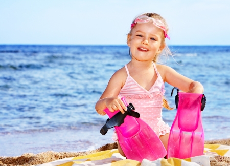 Little girl  playing on  beach.の写真素材