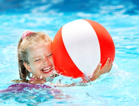 Little girl  swimming in pool.の写真素材
