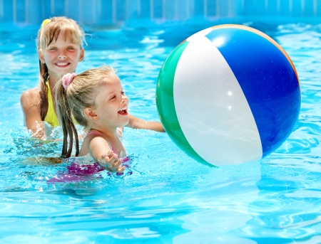 Little girl  swimming in pool.の写真素材