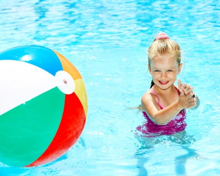 Little girl  swimming in pool.の写真素材