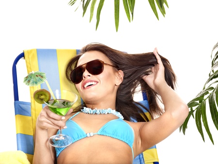 Girl in bikini drinking cocktail. Isolated.の写真素材