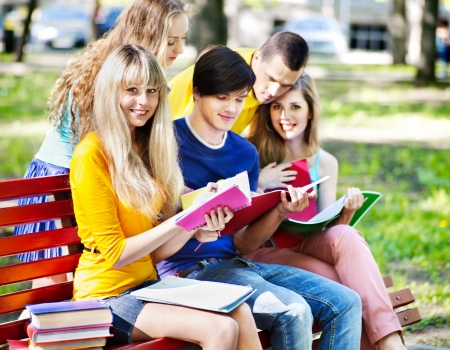 Group student with notebook on bench outdoor.の写真素材