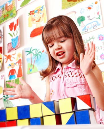 Children in kindergarten stacking block.の写真素材