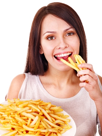 Woman eating french fries. Isolated.の写真素材