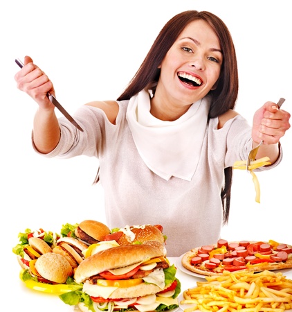 Woman eating fast food. Isolated.の写真素材