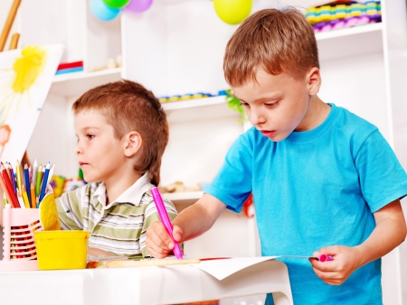 Little boy painting  in kindergarten.の写真素材