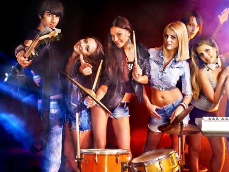 Musical group performance in night club. Lighting effects.の写真素材
