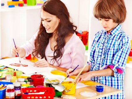 Family with children playing bricks.の写真素材