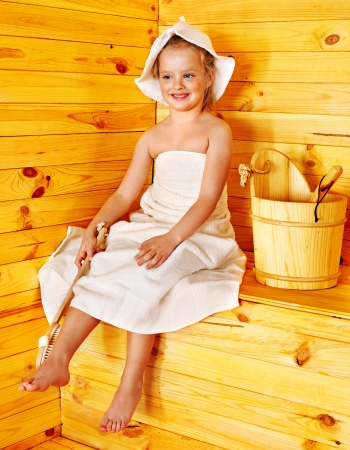 Happy with child relaxing at sauna.の写真素材