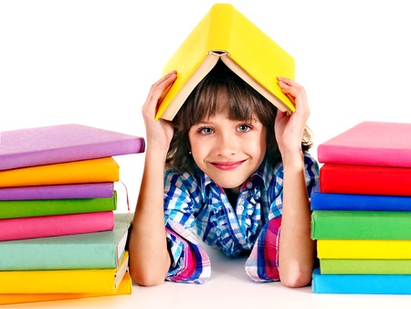 Child with stack of books. Isolated.の写真素材