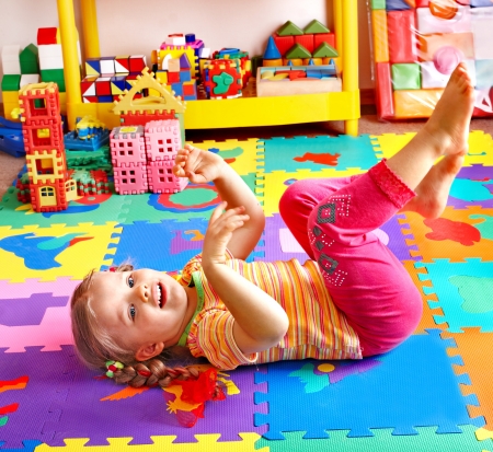 Child  preschooler playing with building block .の写真素材