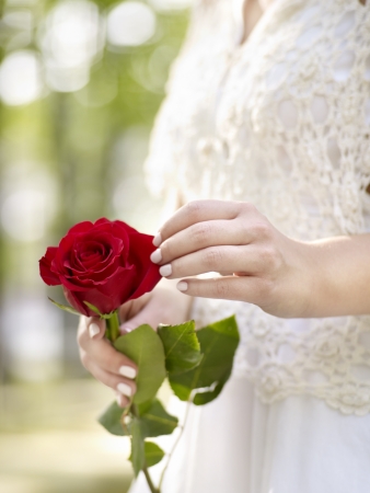 Bride with red rose bouquetの写真素材