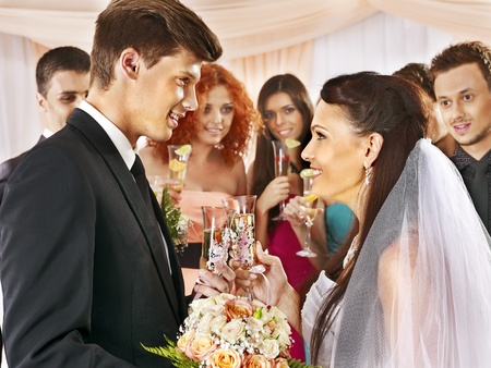 Happy group people drinking champagne at wedding.の写真素材