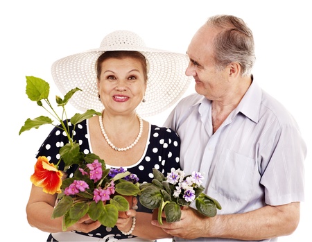 Old couple holding flower. Isolated.の写真素材