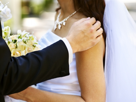 Bride and groom with flower outdoor.の写真素材