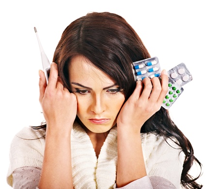 Young woman having pills and tablets. Isolated.の写真素材
