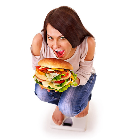 Woman weight loss on scales. Isolated.の写真素材